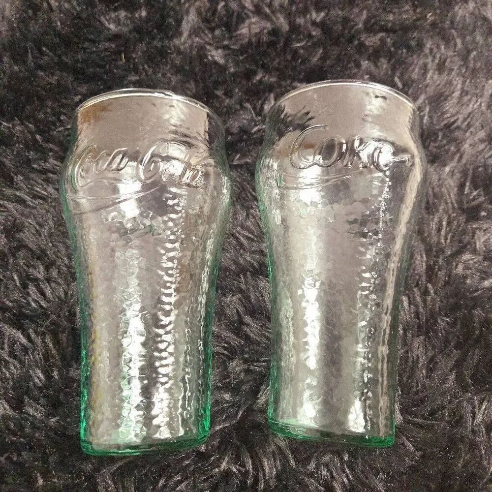 2 vintage Coca-Cola glasses with a green tint and a textured surface, often call